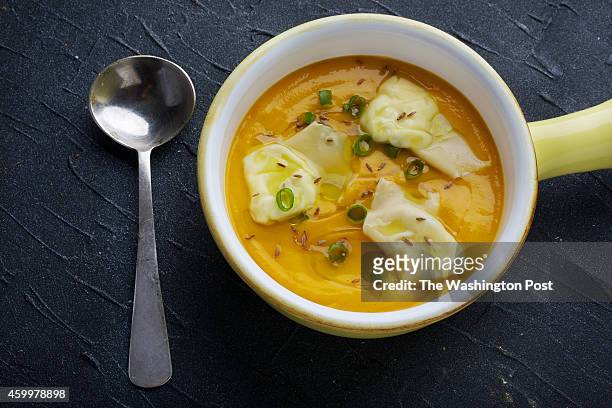 Parsnip, Carrot and Turmeric Root Soup With Goat Cheese Dumplings .