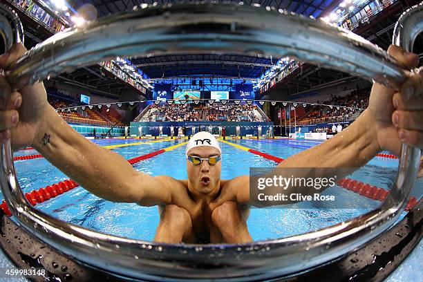 Florent Manaudou of France competes in the Men's 50m Backstroke heats on day three of the 12th FINA World Swimming Championships at the Hamad Aquatic...