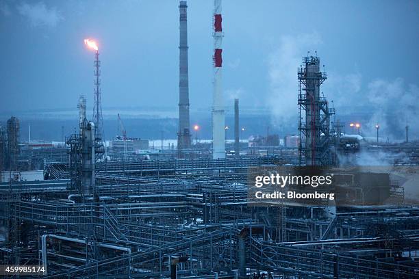 Chimneys, center, stand beyond petroleum cracking towers at the Lukoil-Nizhegorodnefteorgsintez oil refinery, operated by OAO Lukoil, in Nizhny...