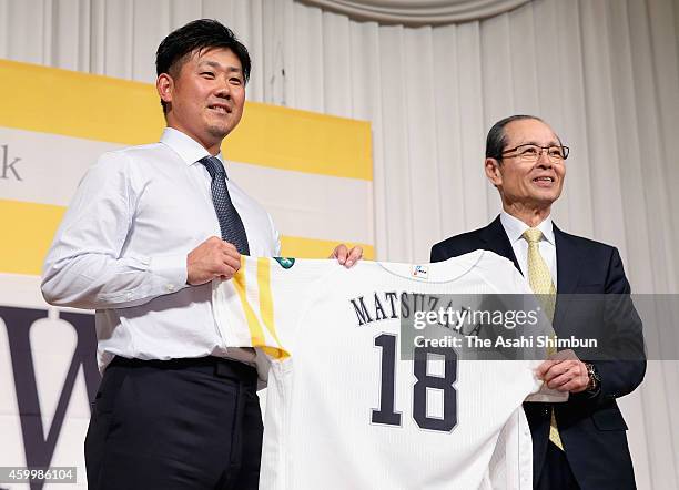 Daisuke Matsuzaka of the Fukuoka SoftBank Hawks and Chairman Sadaharu Oh pose for photographs during a press conference on December 5, 2014 in...