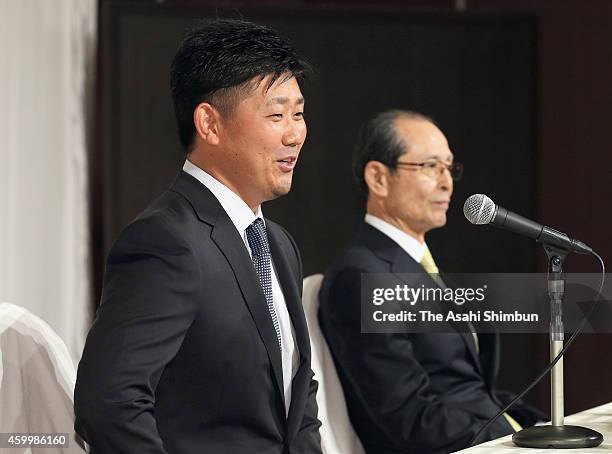 Daisuke Matsuzaka of the Fukuoka SoftBank Hawks speaks during a press conference on December 5, 2014 in Fukuoka, Japan.