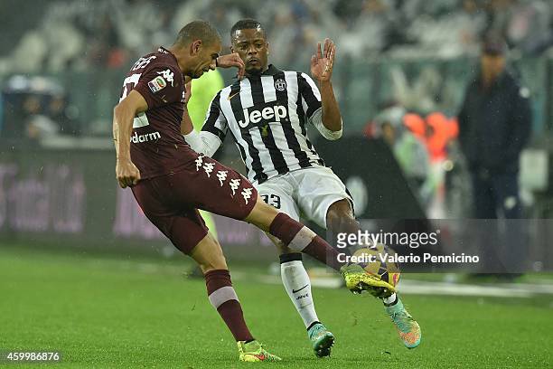 Bruno Peres of Torino FC in action against Patrice Evra of Juventus FC during the Serie A match between Juventus FC and Torino FC at Juventus Arena...