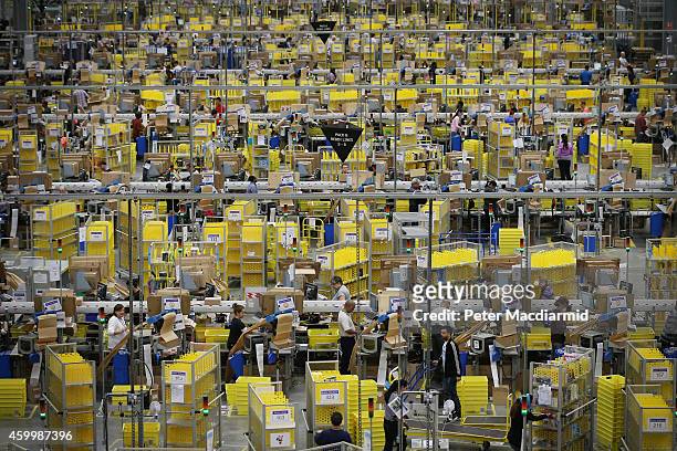 Parcels are prepared for dispatch at Amazon's warehouse on December 5, 2014 in Hemel Hempstead, England. In the lead up to Christmas, Amazon is...