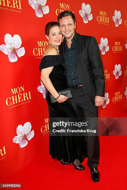 Julia Dahmen and her husband Carlo attend the Mon Cheri Barbara Tag 2014 at Haus der Kunst on December 4, 2014 in Munich, Germany.