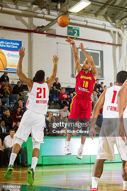 Dahntay Jones of the Fort Wayne Mad Ants shoots a 3-point shot against Christian Watford of the Maine Red Claws on December 4, 2014 at the Portland...