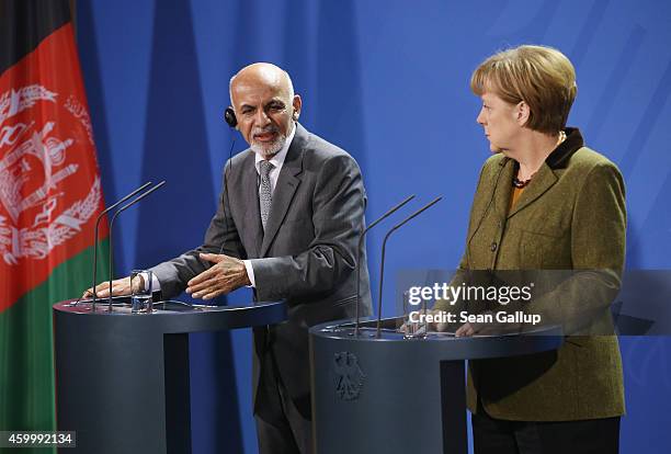 German Chancellor Angela Merkel and Afghan President Ashraf Ghani speak to the media following talks at the Chancellery on December 5, 2014 in...