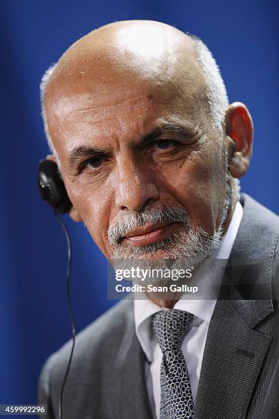 Afghan President Ashraf Ghani speaks to the media with German Chancellor Angela Merkel following talks at the Chancellery on December 5, 2014 in...