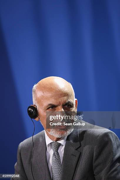 Afghan President Ashraf Ghani speaks to the media with German Chancellor Angela Merkel following talks at the Chancellery on December 5, 2014 in...