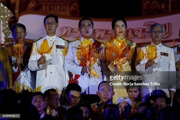 Thai Prime Minister, Prayuth Chan-ocha, holds a candle during a candle light ceremony for King's birthday at Sanam Luang on December 5, 2014 in...