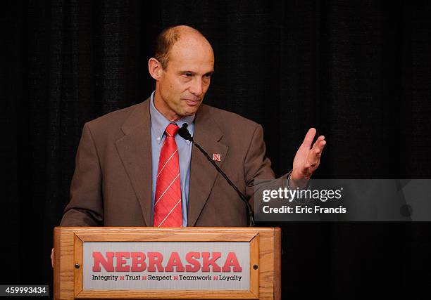 Mike Riley, newly hired head football coach at the University of Nebraska, talks with members of the media during a press conference inside Memorial...