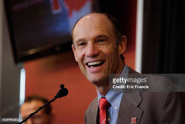 Mike Riley, newly hired head football coach at the University of Nebraska, talks with members of the media during a press conference inside Memorial...