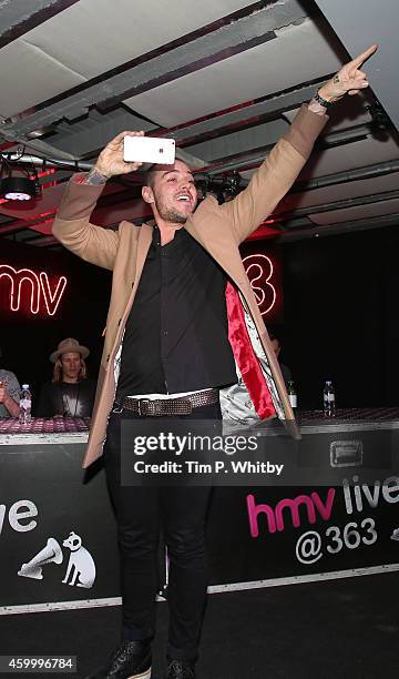 Matt Willis of McBusted meet fans and signs copies of their new self titled album at HMV, Oxford Street on December 5, 2014 in London, England.