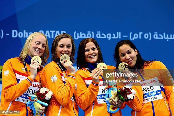 Inge Dekker, Femke Heemskerk, Mud Van Der Merwe and Ranoni Kromowidjojo of the Netherlands celebrates on the podium after winning the Women's 4x100m...