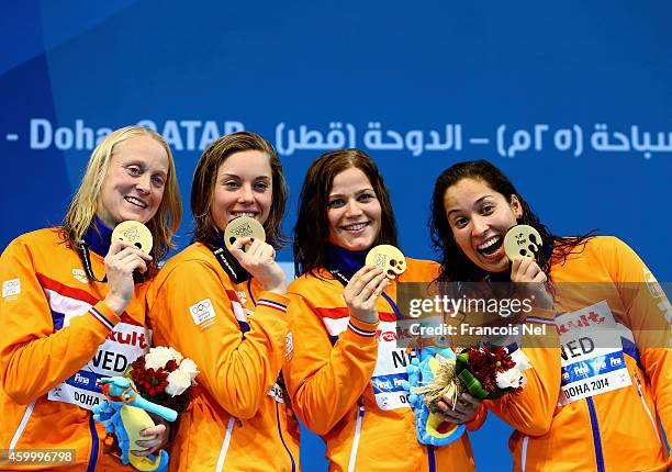 Inge Dekker, Femke Heemskerk, Mud Van Der Merwe and Ranoni Kromowidjojo of the Netherlands celebrates on the podium after winning the Women's 4x100m...