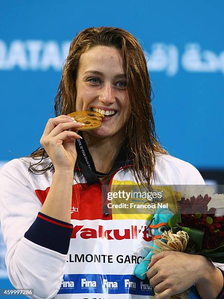 Mireya Garcia Belmonte celebrates on the podium after winning the Women's 400m Freestyle Final during day three of the 12th FINA World Swimming...