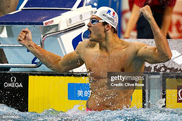 Florent Manaudou of France celebrates after winning the Men's 50m Freestyle Final during day three of the 12th FINA World Swimming Championships at...