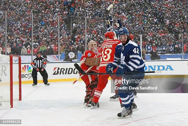 Tyler Bozak of the Toronto Maple Leafs reacts after scoring a goal in the third period against goaltender Jimmy Howard of the Detroit Red Wings...