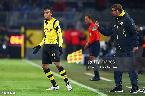 Head coach Juergen Klopp of Dortmund talks to Pierre-Emerick Aubameyang during the Bundesliga match between Borussia Dortmund and 1899 Hoffenheim at...