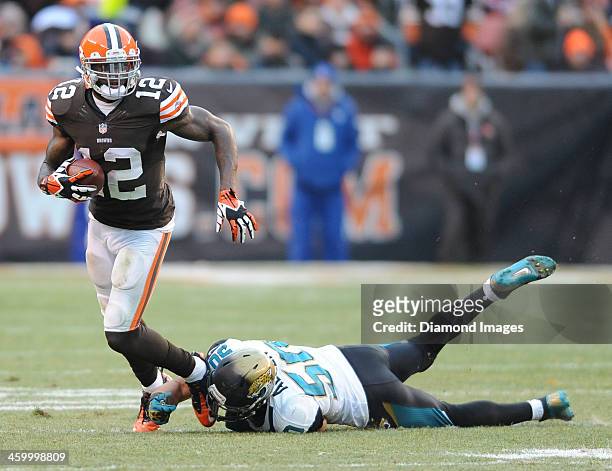 Receiver Josh Gordon of the Cleveland Browns runs away from linebacker Russell Allen of the Jacksonville Jaguars during a game against the...