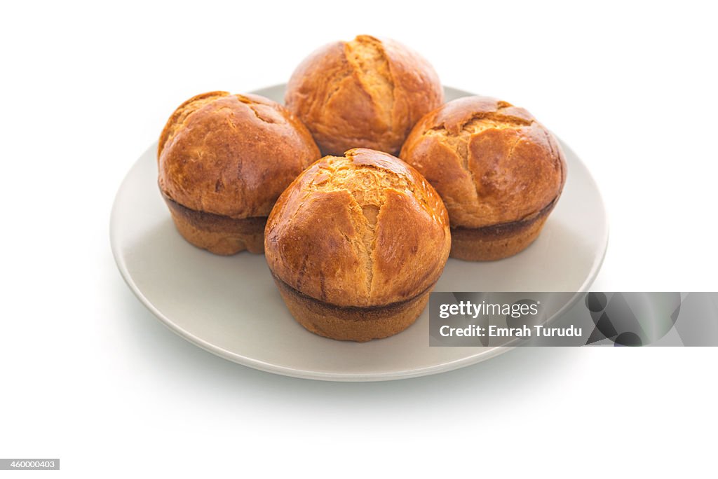 Baked brioche rolls on a plate