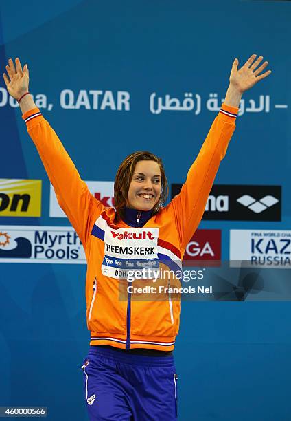 Femke Heemskerk of the Netherlands celebrates on the podium after winning the Women's 100m Freestyle Final during day three of the 12th FINA World...