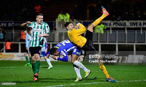 Hartlepool goalkeeper Scott Flinders crashes into defender Dan Jones during the FA Cup Second round match between Hartlepool United and Blyth...