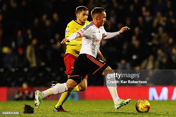 Lasse Vigen Christensen of Fulham holds off the challenge of Almen Abdi of Watford during the Sky Bet Championship match between Fulham and Watford...