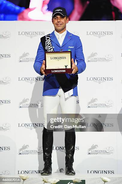 Doda de Miranda from Brazil celebrates his 1st place finish at prize ceremony of the Longines Speed Challenge Prix class as part of the Gucci Paris...