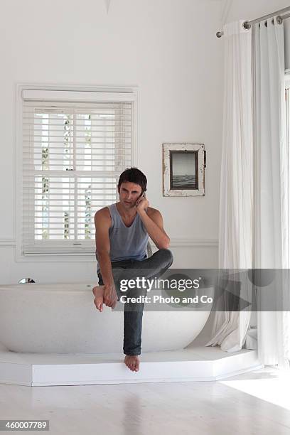 man on cell phone - co op stock pictures, royalty-free photos & images