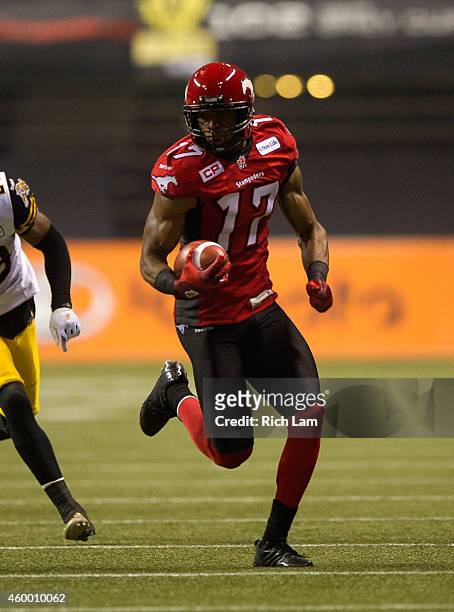 Maurice Price of the Calgary Stampeders runs with the ball during the 102nd Grey Cup Championship Game against the Hamilton Tiger-Cats at BC Place...
