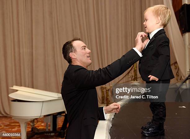 Sprint Cup Champion Kevin Harvick fixes his son Keelan's tie, during the 2014 NASCAR Sprint Cup Series Awards at Wynn Las Vegas on December 5, 2014...