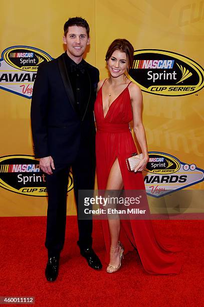 Denny Hamlin and his girlfriend Jordan Fish arrive on the red carpet prior to the 2014 NASCAR Sprint Cup Series Awards at Wynn Las Vegas on December...