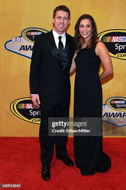 Sprint Cup Series driver Carl Edwards and his wife Dr. Kate Edwards arrive on the red carpet prior to the 2014 NASCAR Sprint Cup Series Awards at...