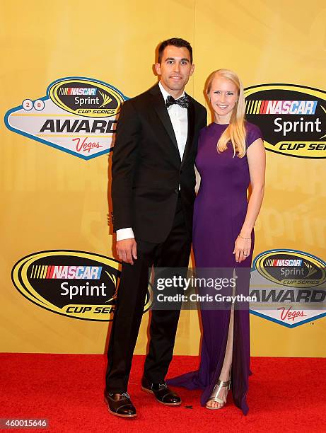 Aric Almirola and his wife Janice Almirola arrive on the red carpet prior to the 2014 NASCAR Sprint Cup Series Awards at Wynn Las Vegas on December...