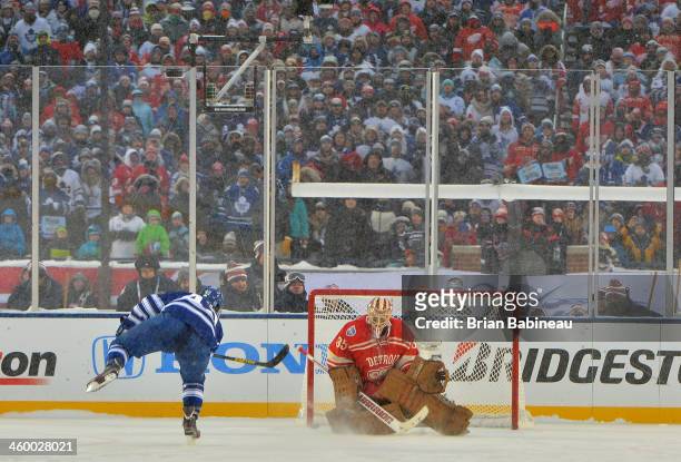 Tyler Bozak of the Toronto Maple Leafs scores on goaltender Jimmy Howard of the Detroit Red Wings during shootout overtime of the 2014 Bridgestone...