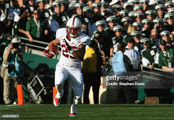 Running back Tyler Gaffney of the Stanford Cardinal rushes with the ball against the Michigan State Spartans during the 100th Rose Bowl Game...