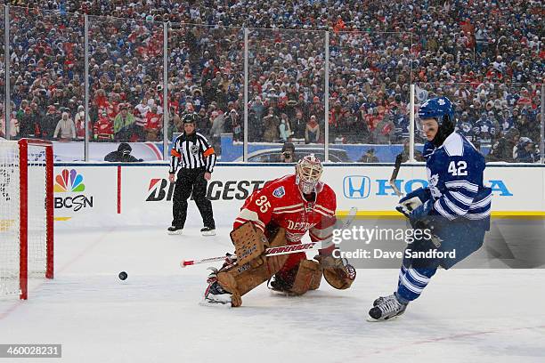 Tyler Bozak of the Toronto Maple Leafs scores on goaltender Jimmy Howard of the Detroit Red Wings during shootout overtime during the 2014...