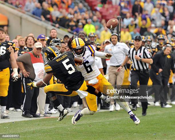 Safety Craig Loston of the LSU Tigers breaks up a pass intended for running back Damon Bullock of the Iowa Hawkeyes January 1, 2014 in the Outback...