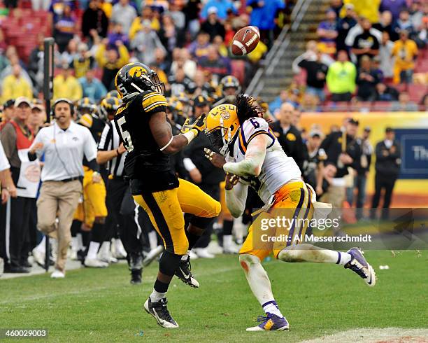 Safety Craig Loston of the LSU Tigers breaks up a pass intended for running back Damon Bullock of the Iowa Hawkeyes January 1, 2014 in the Outback...