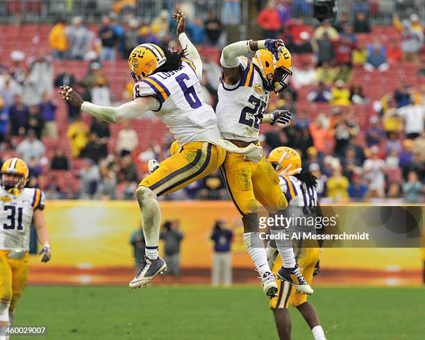 Safety Craig Loston of the LSU Tigers celebrates after breaking up a pass intended for running back Damon Bullock of the Iowa Hawkeyes January 1,...