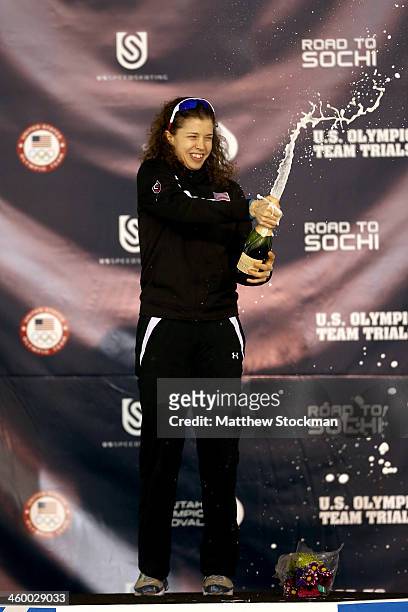 Maria Lamb celebrates on the medals podium after wnning the ladies 5,000 meter during the U.S. Speed Skating Long Track Olympic Trials at the Utah...