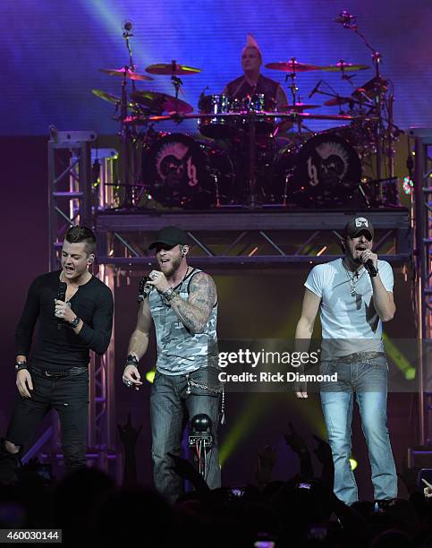 Singer/Songwriter Brantley Gilbert is joined on stage by Chase Bryant and Brian Davis during his "Let it Ride Tour" stop at Bridgestone Arena on...