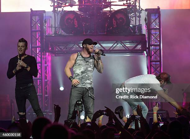 Singer/Songwriter Brantley Gilbert is joined on stage by Chase Bryant and Brian Davis during his "Let it Ride Tour" stop at Bridgestone Arena on...