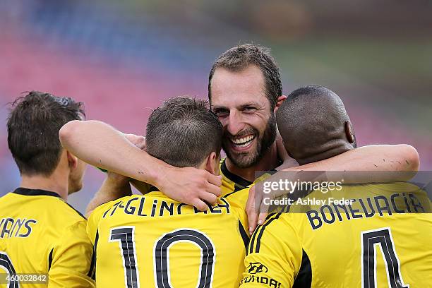 Andrew Durante of the Phoenix celebrates a goal with his team during the round 10 A-League match between the Newcastle Jets and the Wellington...