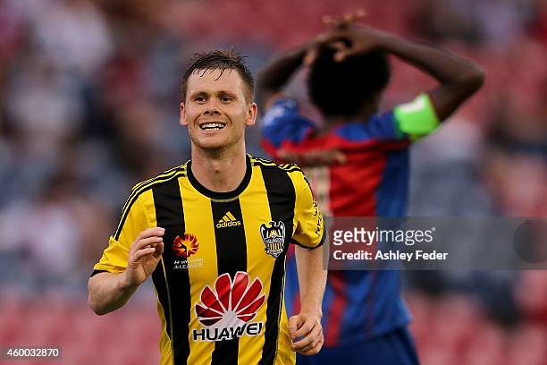 Michael McGlinchey of the Phoenix celebrates a goal with Kew Jaliens of the Jets looking dejected in background during the round 10 A-League match...