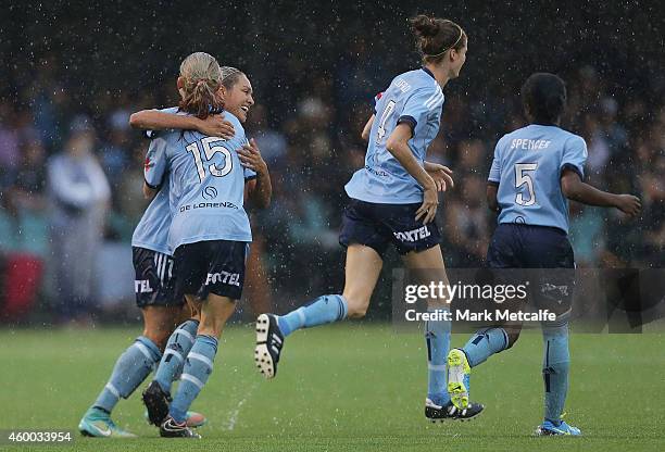 Kyah Simon of Sydney celebrates scoring a goal with team mates during the round 12 W-League match between Sydney FC and Newcastle Jets at Lambert...