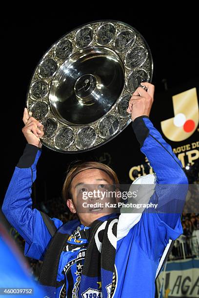 Takashi Usami of Gamba Osaka holds schale as J1 Champions during the J.League match between Tokushima Vortis and Gamba Osaka at Naruto Otsuka Sports...