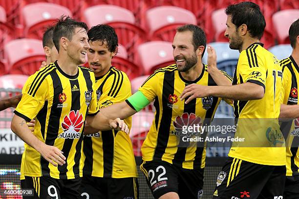 Wellington Pheonix team mates celebrate a goal during the round 10 A-League match between the Newcastle Jets and the Wellington Phoenix at Hunter...