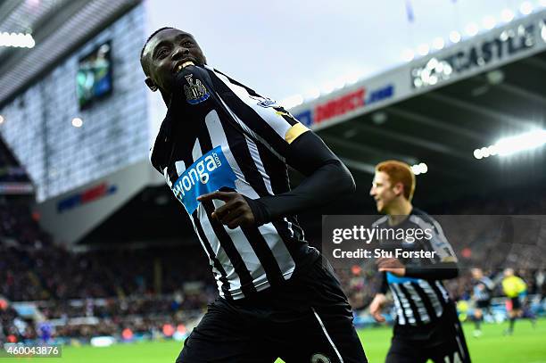 Papiss Cisse of Newcastle celebrates after scoring the opening goal during the Barclays Premier League match between Newcastle United and Chelsea at...