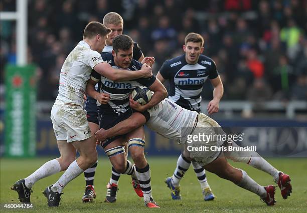 Mark Easter of Sale Sharks is tackled by Jacques Burger of Saracens during the European Rugby Champions Cup match between Sale Sharks and Saracens at...